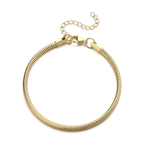Adjustable golden snake bone chain bracelet with lobster clasp on white background