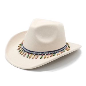 Detail of beige felt cowboy hat featuring bohemian colorful beaded decorative band