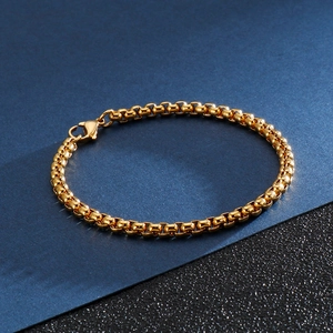 Close-up of golden titanium steel square pearl chain bracelet with lobster clasp