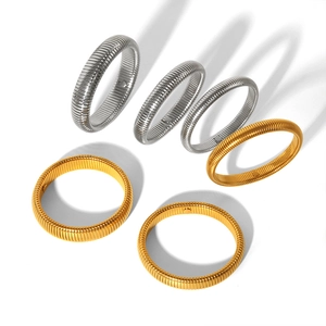 Polished stainless steel Tubogas spring bracelets in gold and silver finishes