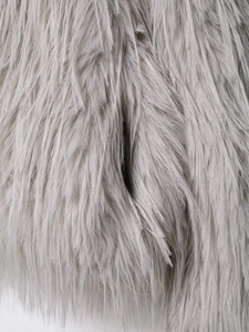 Close-up of soft grey faux fur texture on fashion lapel coat showing long smooth fibers