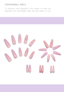 Detail of long ballet press-on nails with floral patterns, glitter, and rhinestones