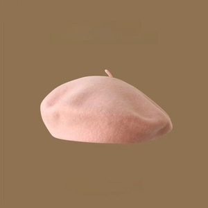 Detailed texture of pink Australian wool beret featuring a soft felt finish and 2022AW logo