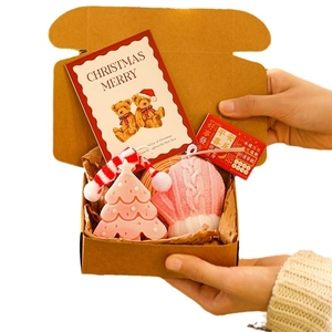 Christmas gift set with pink tree and glove scented candles in a rustic kraft paper box