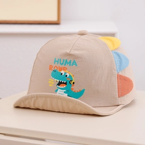 Close-up of cotton baby sun hat featuring dinosaur print and colorful fabric spikes