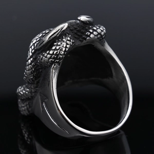 Detailed macro view of the intricate snake scale textures on the stainless steel ring