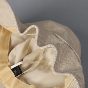 Beige cotton linen bucket hat with shapeable brim and memory wire for easy styling
