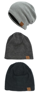 Close-up of knit beanies in grey and black featuring honeycomb waffle texture and leather patch