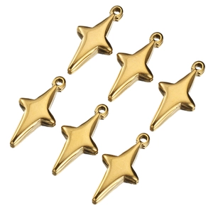 Close-up of six gold starburst pendants made of polished stainless steel for jewelry making