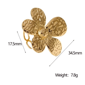 Macro shot of large golden flower ring with textured metal petals and size dimensions