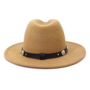 Detailed macro view of camel wool fedora hat texture with black leather belt and metal buckle