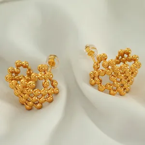 18K gold plated mesh C-shaped beaded sphere earrings on elegant satin background