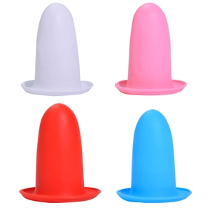 Set of four colorful silicone leak-proof sleeves for travel bottles in white, red, pink, and blue