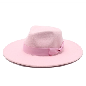 Detail of a soft pink wool fedora hat with a matching grosgrain ribbon and small bow