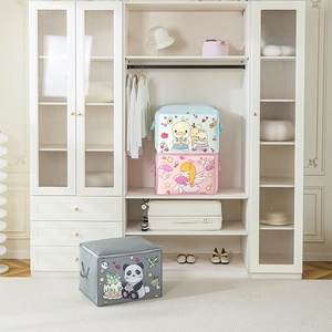 Detail view of cartoon fabric storage bags with durable handles and dual zippers