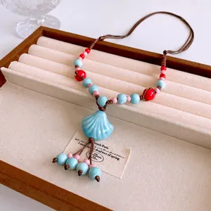 Bohemian multi-layer ceramic shell pendant necklace with colorful beads and tassels
