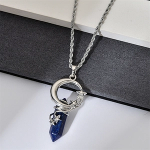 Detail of silver crescent moon and star wire wrapped deep blue crystal pendant necklace