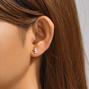 Close-up of minimalist S925 sterling silver ear studs with triple rectangular zircons