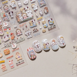 Close-up of 5D embossed nail stickers featuring cute dog patterns and dessert motifs