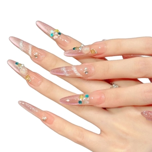 Pink handmade press-on nails with luxury sea theme pearls and glitter stiletto design