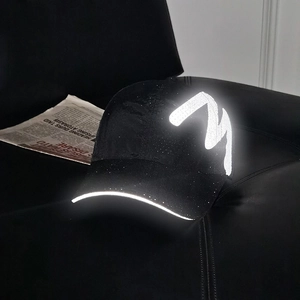 Black outdoor reflective mesh baseball cap with M logo and high-visibility brim details