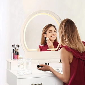 Modern vanity desk featuring a circular LED lighted mirror and jewelry organizer set