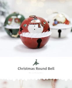 Close-up of red metal Christmas bell with cutout stars and snowman illustration