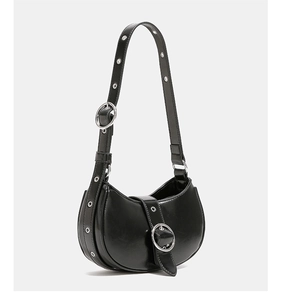 Detail of black crescent shoulder bag featuring stylish metal ring buckle and hardware