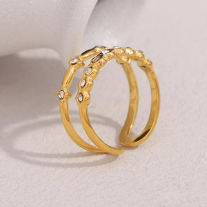 Detail of 18K gold plated double-layer open ring with sparkling zircon stones