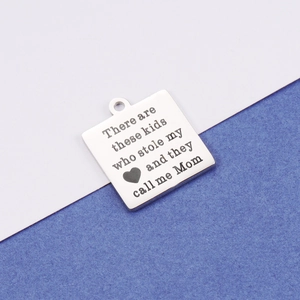 Polished stainless steel MOM square pendant with engraved quote on two-tone background