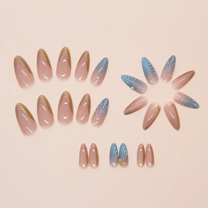 Detailed view of almond fake nails with blue gradient seashell texture and tiny pearls