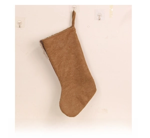 Back view of brown plush Christmas stocking with dark faux fur trim and hanging loop