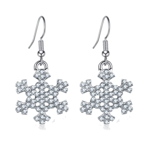 Detailed close-up of silver snowflake earrings with sparkling inlaid crystals