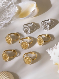 Macro view of gold and silver religious deity rings with 5A zircon and 18K gold plating