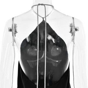 Detail of black satin backless dress with silver rhinestone halter neck strap and open back