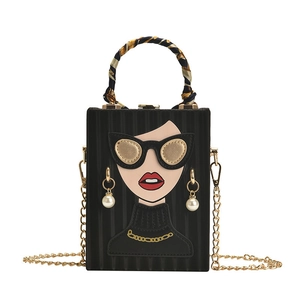 Graffiti box evening bag with red lip face pattern, silk scarf handle, and chain strap