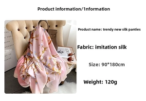 Detail view of pink floral faux silk scarf measuring 90x180cm with soft silky texture