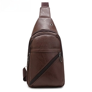 Close-up of brown Oxford cross-body bag with FASHION text and adjustable nylon strap