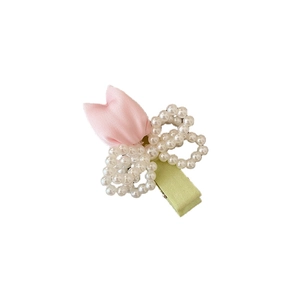 Pink fabric tulip hair clip with white pearl bow on green base for women and girls