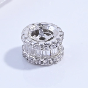 Close-up of S925 silver wheel spacer bead with cubic zirconia for DIY jewelry
