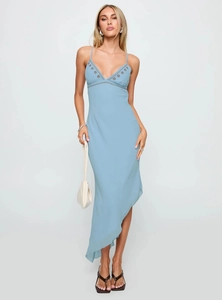Detail of blue slip dress featuring gold floral embroidery and delicate v-neckline