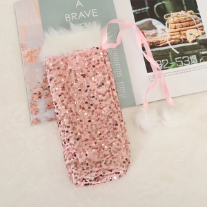 Pink sequin Christmas wine bottle cover with faux fur trim and white pom pom ties