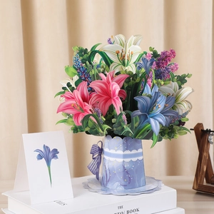 Macro detail of 3D pop-up lily bouquet card with pink flowers in a blue lace pot