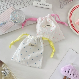 Cute cotton drawstring storage bags with heart prints in pink and blue colors