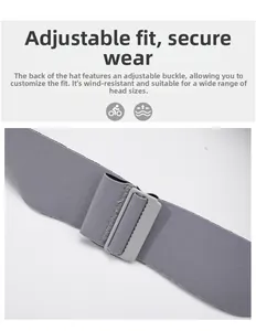 Detail view of the adjustable gray buckle and elastic strap on a foldable sun visor hat