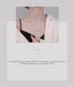 Detail view of a refined S925 sterling silver heart pendant necklace on a model