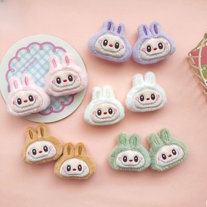 Detailed set of ten plush bunny DIY accessories in five macaron colors with embroidery