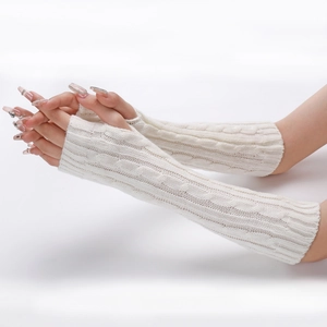 Close-up of white cable knit arm warmers showing soft wool texture and fingerless design