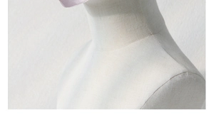 Close-up of the smooth silk sunmask fabric texture and stitching on a mannequin