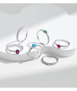 Detailed macro view of S925 sterling silver rings set with vibrant colorful gemstones